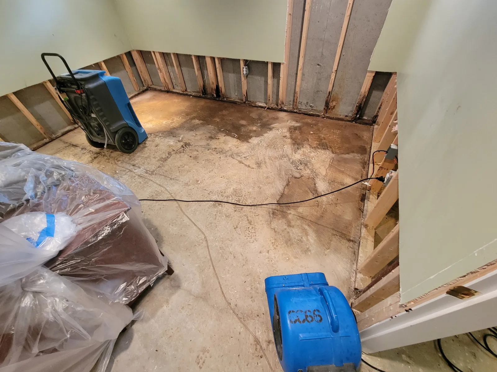 Basement drying equipment after water intrusion.