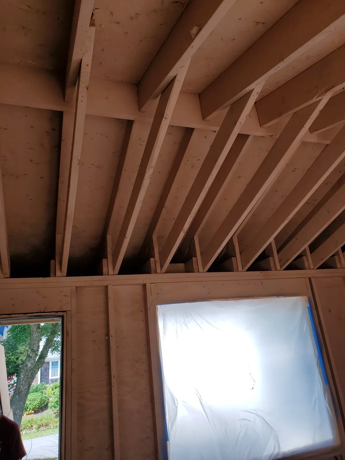 Room framing and window area during restoration.